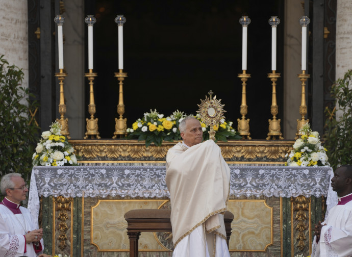 Pope Leo XIV hoists a monstrance in front of outside the St. Mary Major Basilica, in Rome, Sunday, May 22, 2025. (AP Photo/Domenico Stinellis)
