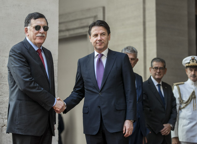 Al Sarraj e Conte in tempi migliori Al Sarraj e Conte in tempi migliori