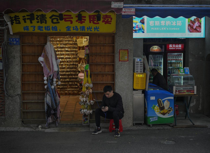 Negoziante a Xiamen, Cina (La Presse) Negoziante a Xiamen, Cina (La Presse)